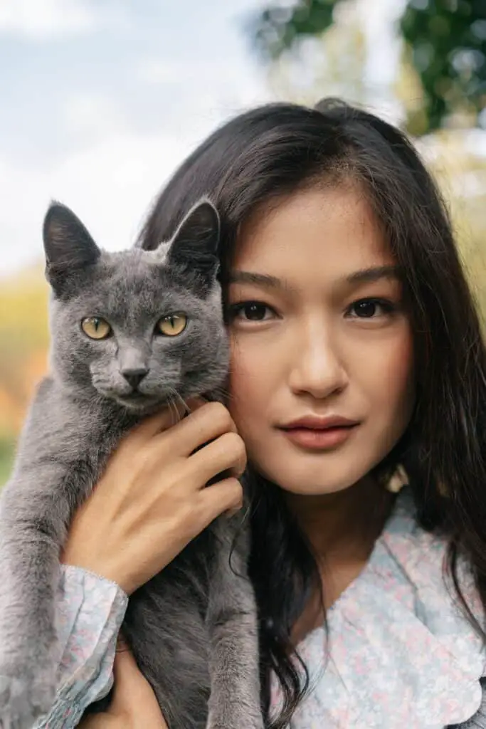 woman with a russian blue cat